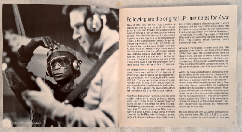 The original liner notes were included, but this time with photographs. This one shows Miles with John McLaughlin in the studio.