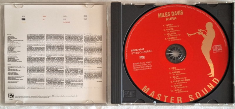 The CD Jewel case opened to reveal an alternative red label design.