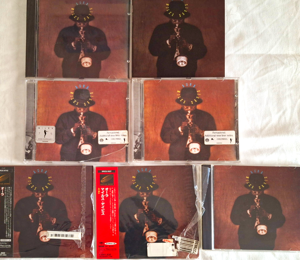Aura has been released in several CD formats, standard CD (top); remastered (middle) and several Master Sound versions (bottom)
