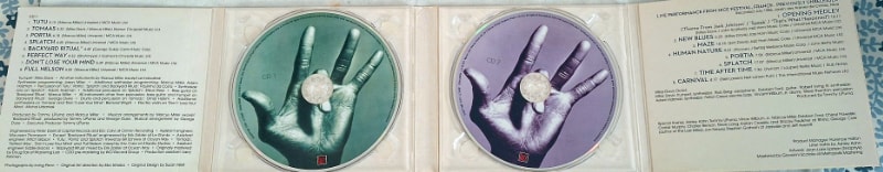 The inside covers, including the green and mauve CD labels.