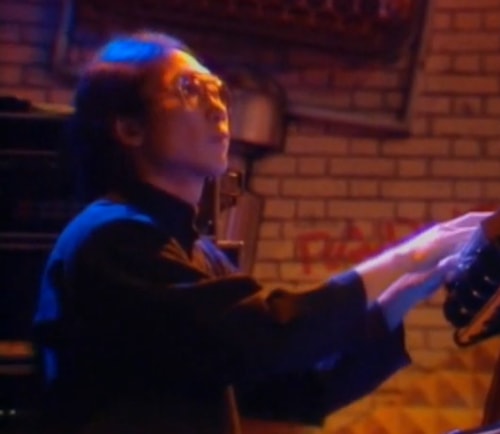 Keyboard player Kei Akagi plays live on stage at a Miles Davis concert in 1989.