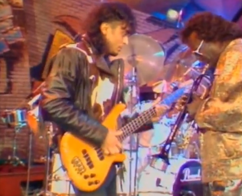 Miles Davis and guitarist Benny Rietveld play on stage in 1989.
