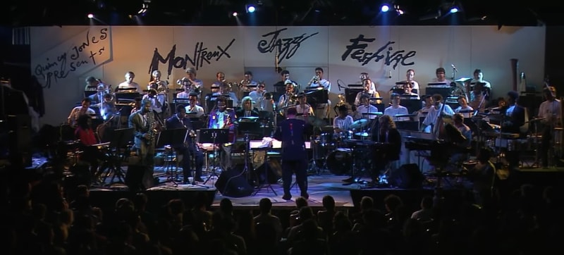 Miles Davis and Quincy Jones performing on stage in Montreaux with the band.