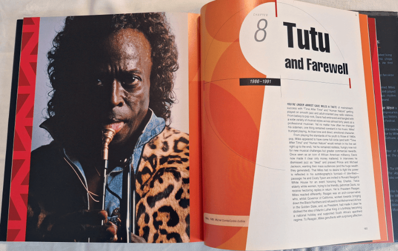 Miles Davis – The Complete Illustrated History spread with portrait of Miles sticking his tongue out.