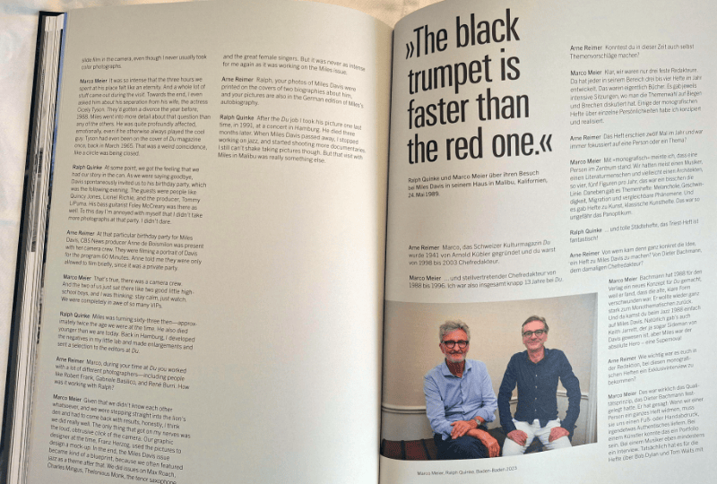 Photo of the authors and an interview in English and German.