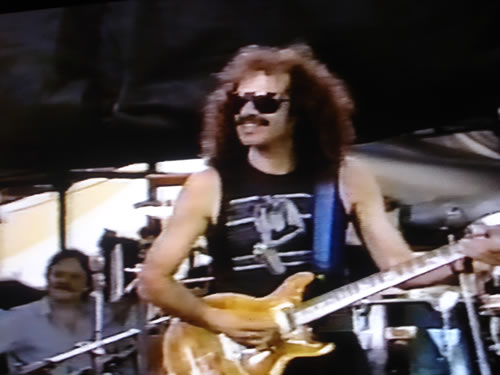 Carlos Santana playing with Miles Davis, Giants Stadium, New Jersey 1986